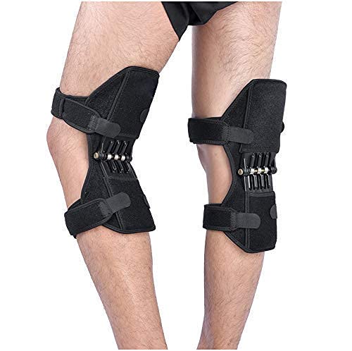 Black knee brace on a person's legs against a white background